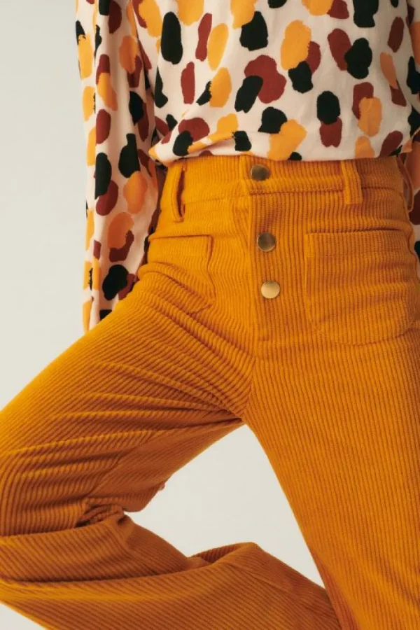 pantaln_de_nia_de_pana_am_2.webp Pantalón de niña de pana amarillo-MINI Sale